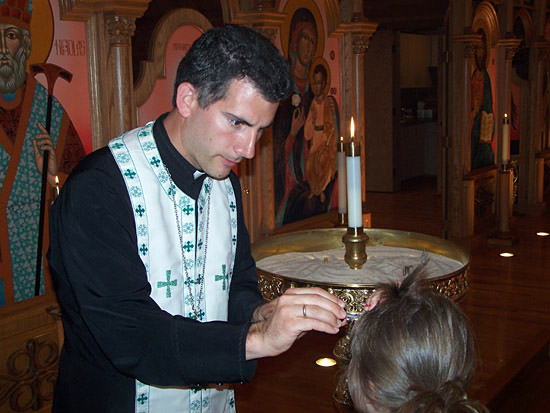 Fr Stephen Loposky Annoints Child